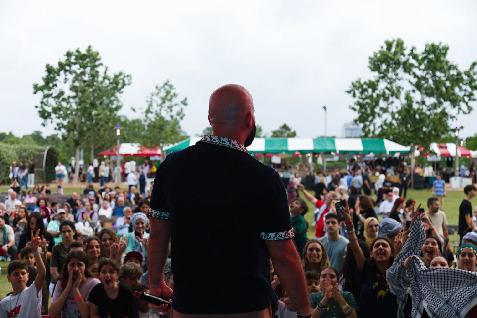A large audience celebrating at the 2025 Houston Palestinian Festival