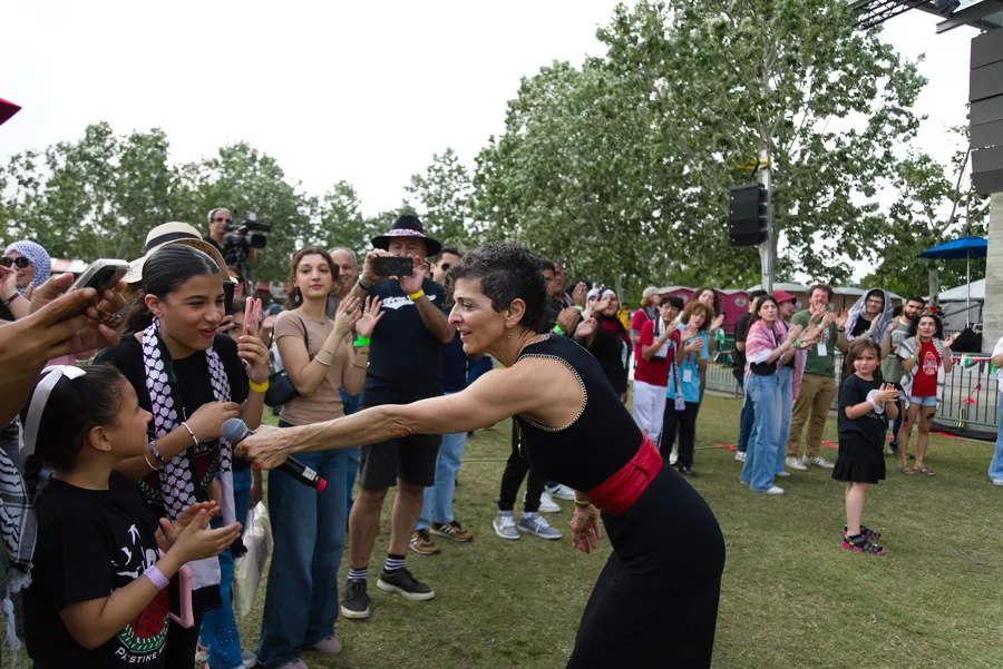 Festival participants joining a family activity
