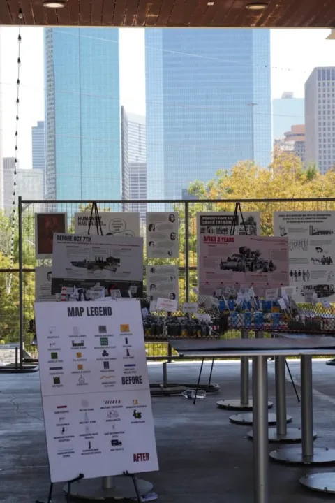 Festival exhibit with a model and map legend