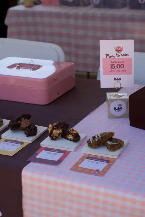 Cookies displayed on a table at a festival market stall.