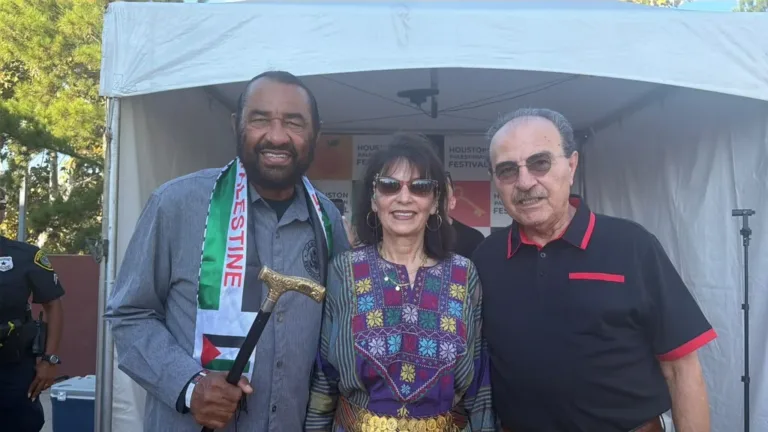 Rep. Al Green, on the left, with two attendees at the Houston Palestinian Festival.